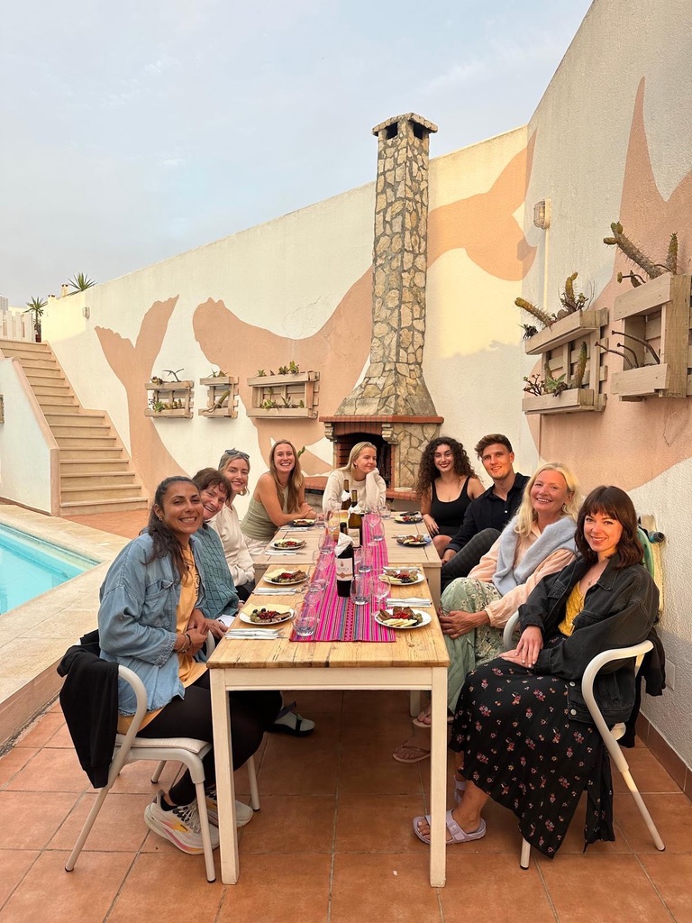 Community dinner by the pool at a private retreat, Ericeira Portugal